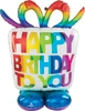 A balloon shaped like a gift box and has a happy birthday to you message on it