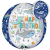 A blue balloon that says happy birthday surrounded by shakrs, fish, and jellyfish